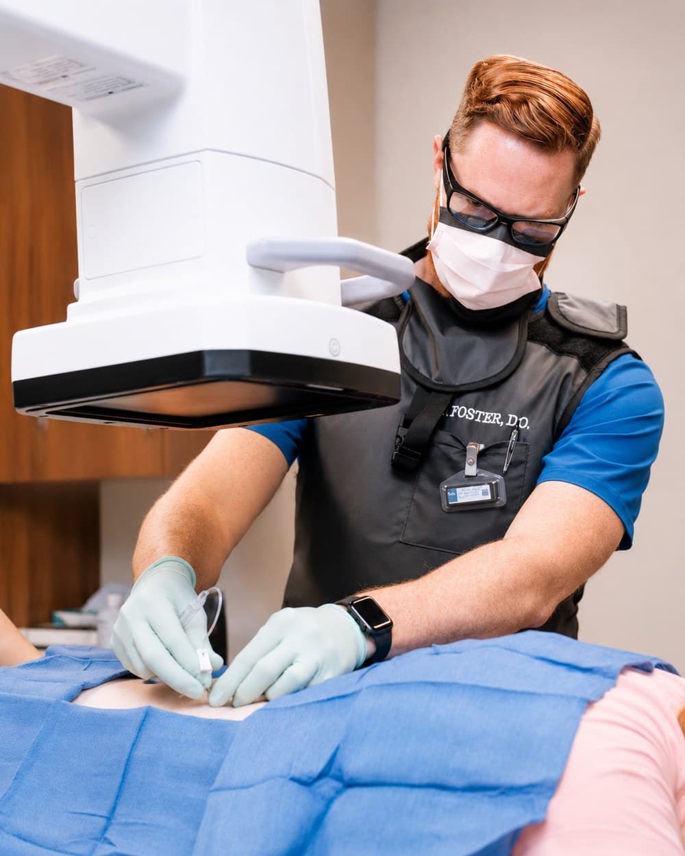 Dr. Foster performing an injection under fluoroscopic guidance.