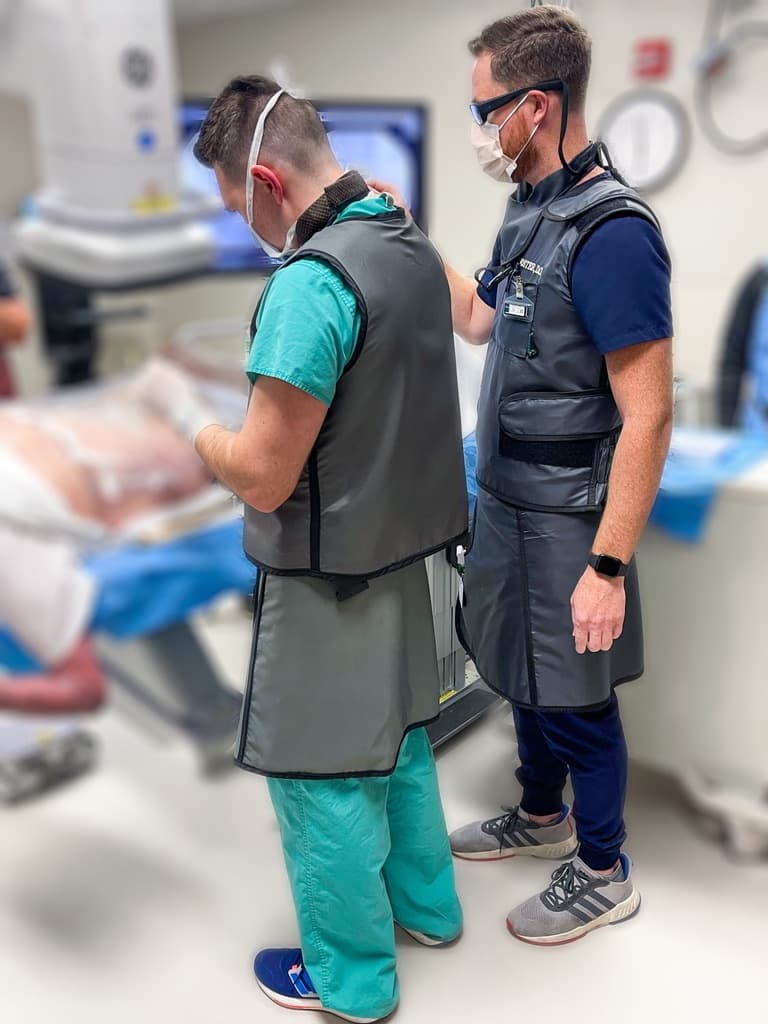 Dr. Foster proctoring a fluoroscopy-guided procedure with a physician in training