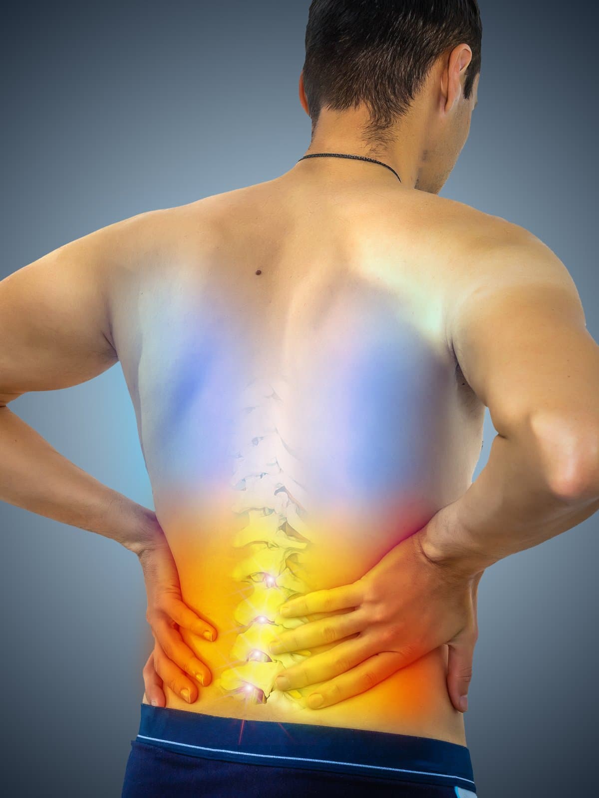 A man holding his lower back with both hands, with a glowing X-ray overlay of the spine highlighting the facet joints.